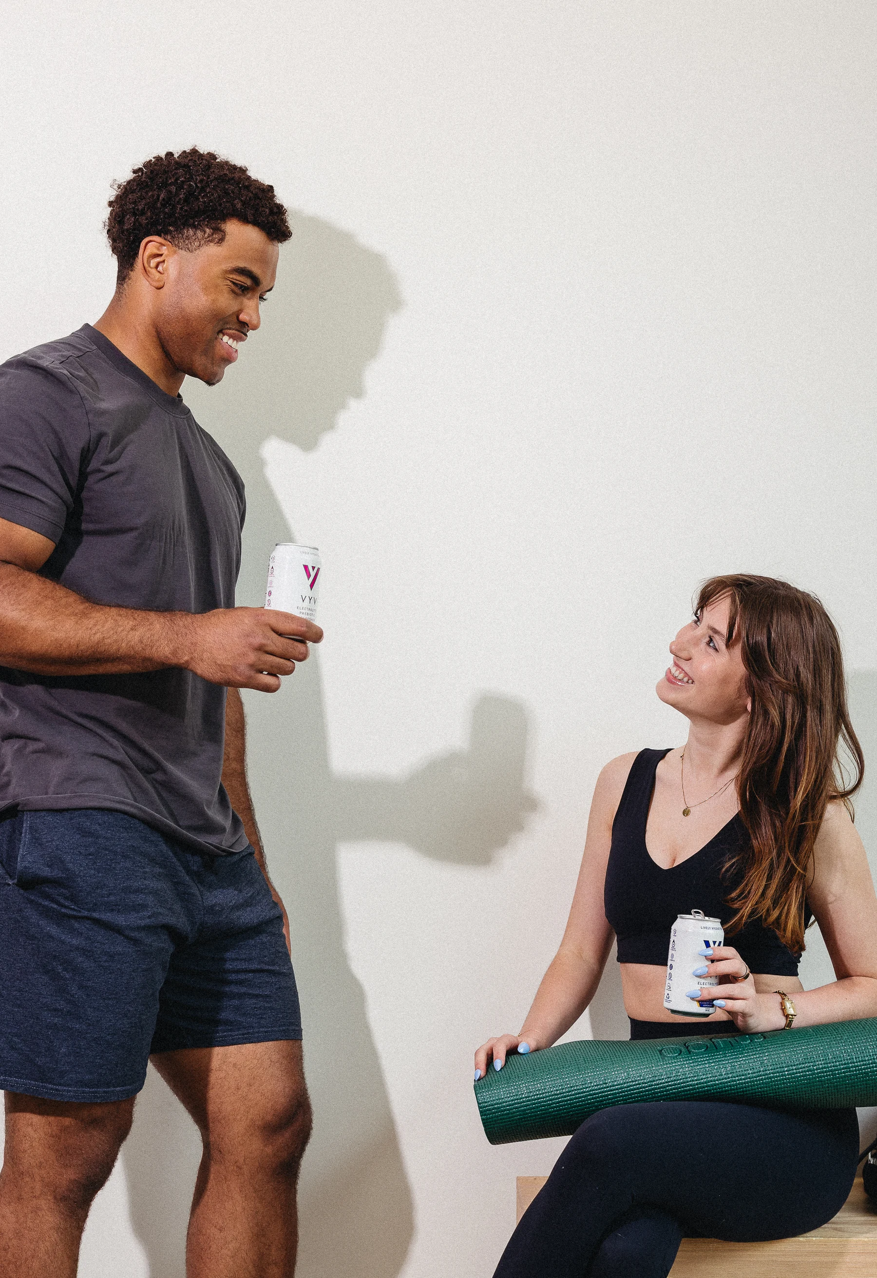 A conversation beside a yoga mat in the studio, photographed by Courtney Terry.